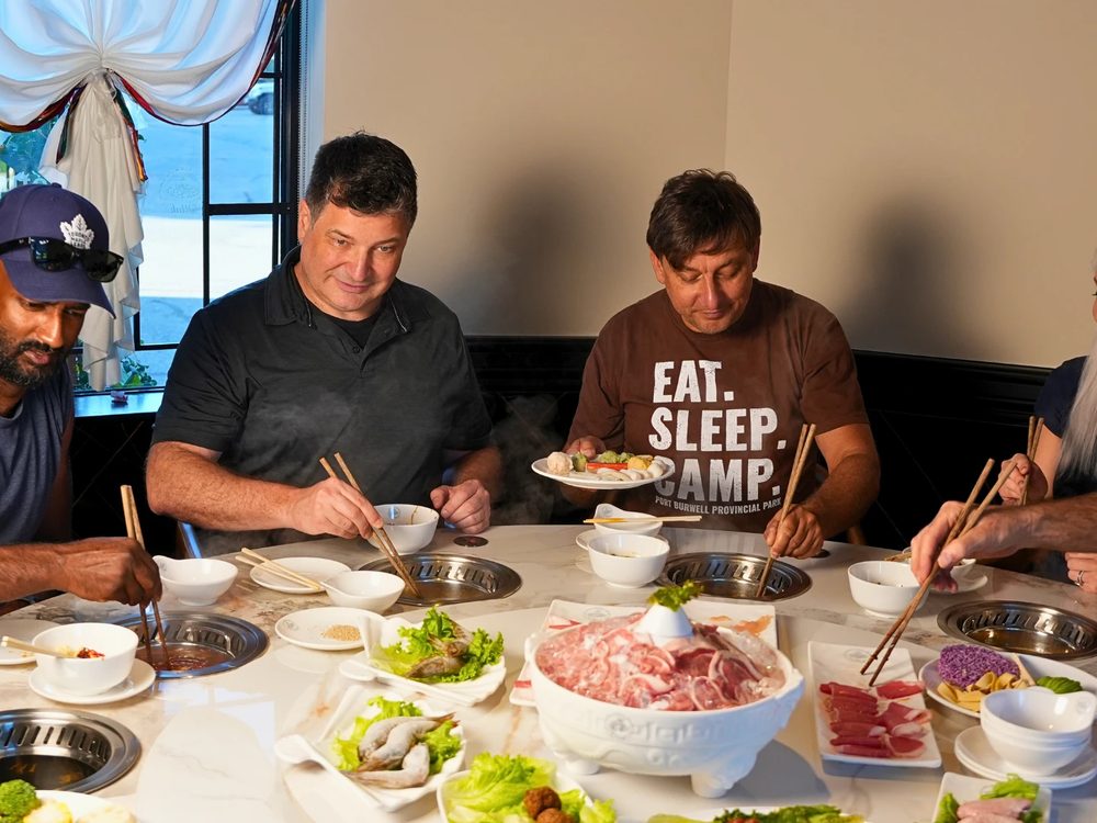 A group of four sharing a hot pot combo at Otluk Hot Pot