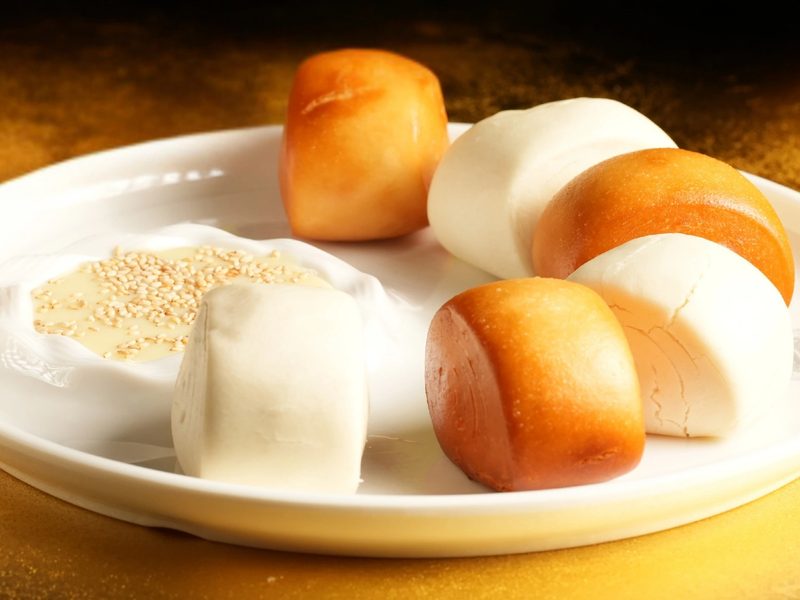 Fried and steamed mantou buns with a dish of sesame sugar