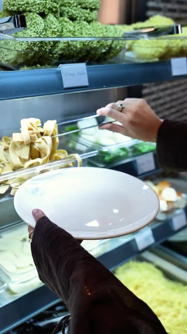 Tofu skin noodles lifted from the self-serve bar