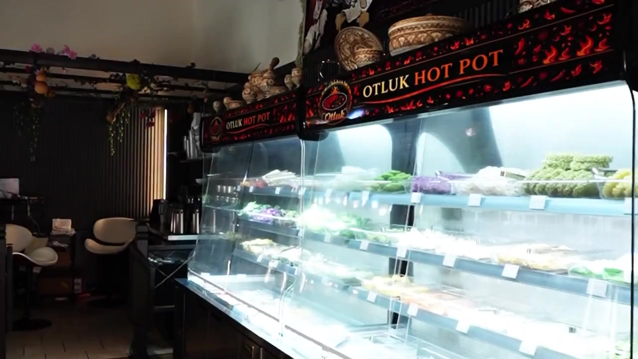 The self-serve bar at Otluk Hot Pot stocked with vegetables, noodles and tofu