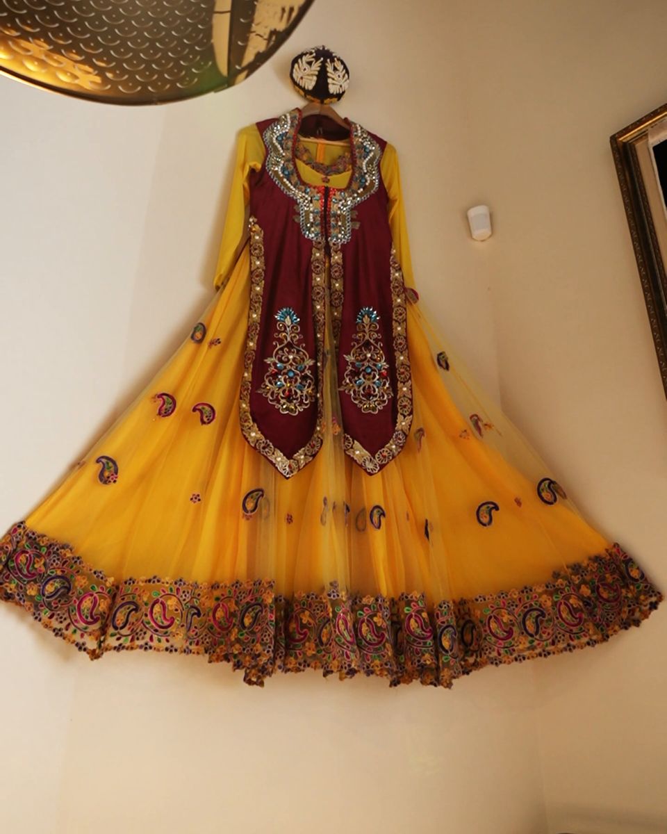 A traditional Uyghur dress hanging in the dining room